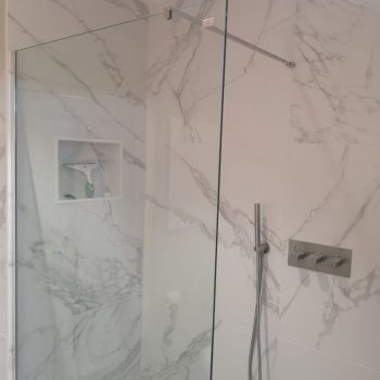 image of bathroom shower & tiles by Sutton & Vining