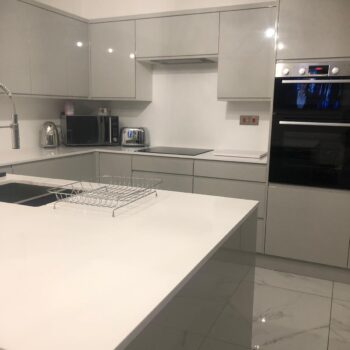 image of kitchen grey cupboards by Sutton & Vining