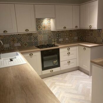 large white kitchen with modern tiling