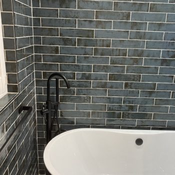 close up of bathroom with grey tiles